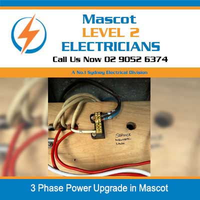 Close-up of 3 phase power wiring and electrical connections during upgrade work in Mascot