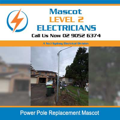 Level 2 electrician working on new power pole installation in residential area in Mascot